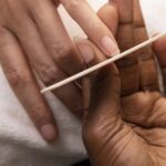 high angle woman getting manicure(1)